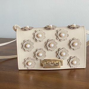 Zac Posen cream flower purse